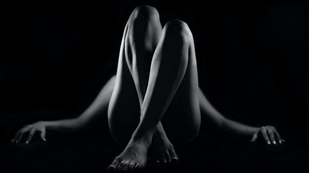 A black and white artistic nude